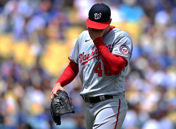 July 27, 2022;  Los Angeles, California, USA;  Washington Nationals starting pitcher Patrick Corbin (46) walks to the dugout after he was pulled from the game after giving up his sixth run of the first inning against the Los Angeles Dodgers at Dodger Stadium.