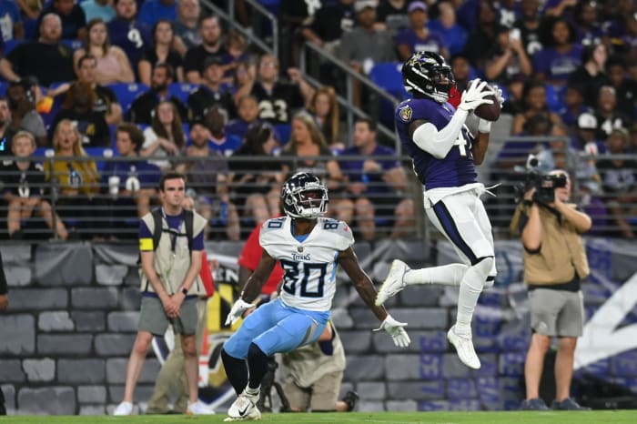 Aug 11, 2022;  Baltimore, Maryland, USA;  Baltimore Ravens cornerback Daryl Worley (41) intercepts a pass intended for Tennessee Titans wide receiver Terry Godwin (80) during the second half at M&T Bank Stadium.