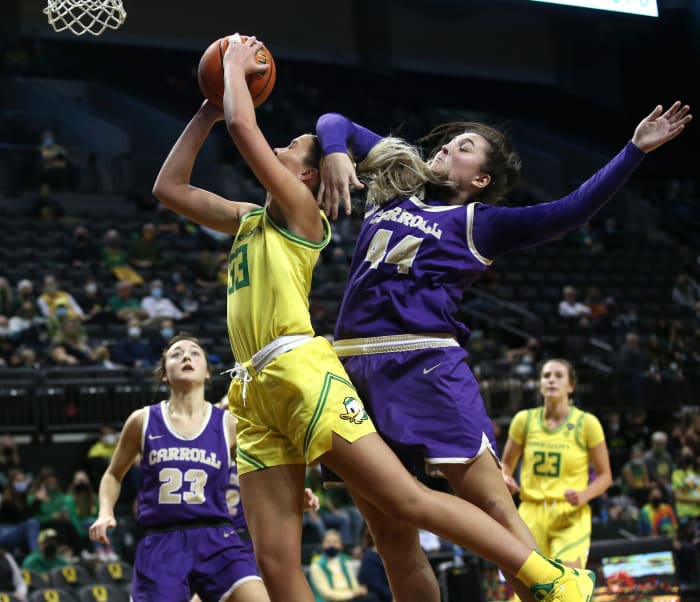Sidney Parrish was fouled by Carroll College's Maddie Geritz when he scored in the second half at Eugene on January 2, 2022.