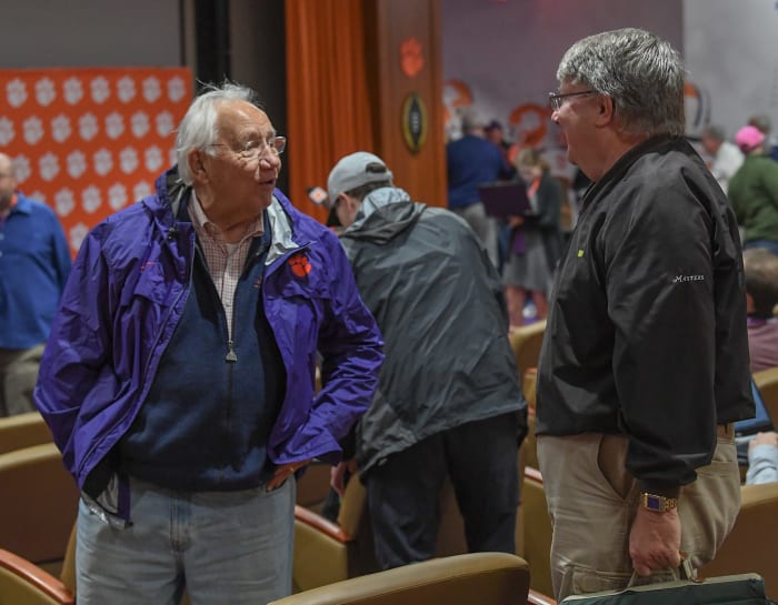 George Bennett, left, former Executive Secretary of IPTAY and long-time Clemson supporter, talks with former Clemson Sports Information Director Tim Bourret after a Clemson University football press conference on October 22, 2019. Bennett is the man responsible for starting Clemson's $2 bill tradition, which began with Clemson's trip to Georgia Tech in 1977.