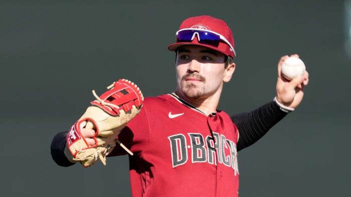 Feb 21, 2022;  Scottsdale, Ariz., US;  Diamondbacks minor league outfielder Corbin Carroll throws during a select training camp for minor-league players not covered by the Players Association at Salt River Fields.  MLB continues to be in a lockout after the expiration of the collective bargaining agreement Dec.  2.