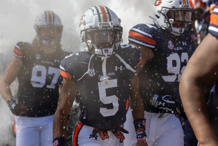 Jay Fair, Marquis Burks, and Brandon Frazier come out of the tunnel vs Missouri.