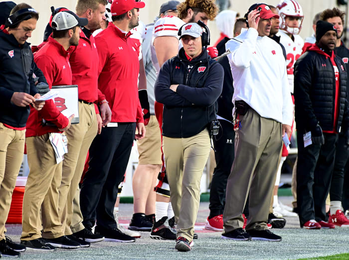 Wisconsin interim head coach Jim Leonhard walking on the sidelines.