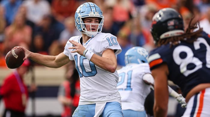 UNC quarterback Drake Maye winds up to throw a pass