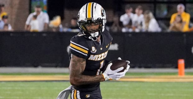 Missouri Tigers wide receiver Theo Weese catches a pass during a college football game in the SEC.