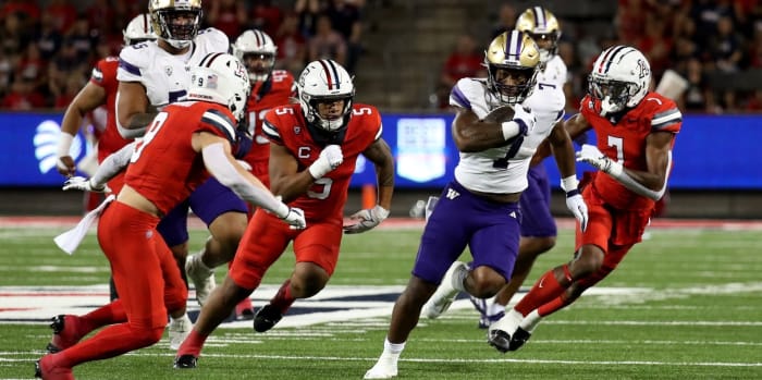 College running back Dillon Johnson (7) runs away, and future Husky cornerback Efejians Pricock (7) gives chase.