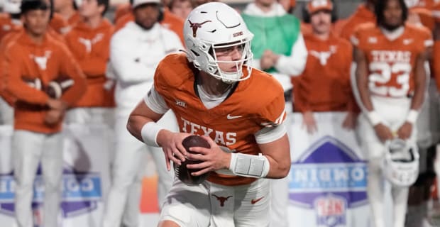 Texas Longhorns quarterback Arch Manning attempts a pass during an SEC college football game.