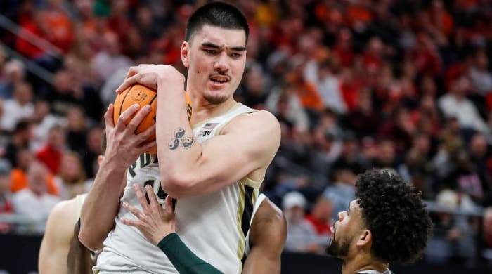 Purdue center Zach Edey (15) grabs a rebound against Michigan State forward Malik Hall (25) during the second half of the Big Ten Tournament quarterfinals at Target Center in Minneapolis, Minn., Friday, March 15, 2024.  