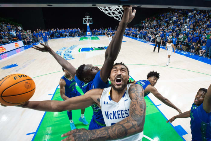 McNeese's Christian Shumate is blocked by TAMUCC's Stephen Giwa during the game at the American Bank Center on Monday, Jan. 22, 2024, in Corpus Christi, Texas.  