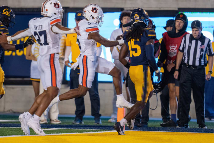 Sep 9, 2023; Berkeley, California, USA; Auburn Tigers wide receiver Jay Fair (5) rushes for the touchdown against California Golden Bears defensive back Lu-Magia Hearns III (15) during the second quarter at California Memorial Stadium. Mandatory Credit: Neville E. Guard-USA TODAY Sports