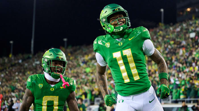 Oregon wide receiver Troy Franklin, right, celebrates after scoring a touchdown