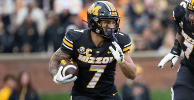 Missouri Tigers running back Cody Schrader's rushing attack during a college football game in the SEC.