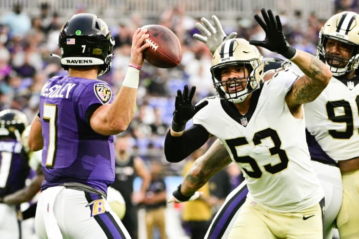 New Orleans Saints linebacker Zack Baun (53) and defensive tackle Shy Tuttle (99) rush Baltimore Ravens quarterback Trace McSorley