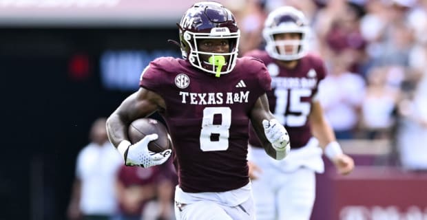 During a college football game in the SEC, Texas A&M running back Le'Veon Moss in the rushing attack.