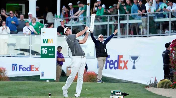 Scottie Scheffler tees off on the 16th hole at the 2023 WM Phoenix Open.