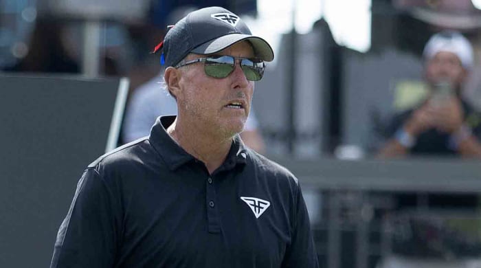 Phil Mickelson looks over the 18th hole before teeing off for the final round of the 2023 LIV Golf Chicago tournament.