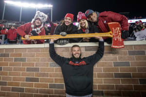 Wisconsin linebacker Jack Cichy posing with the Axe after beating Minnesota (Credit: Jesse Johnson-USA TODAY Sports)