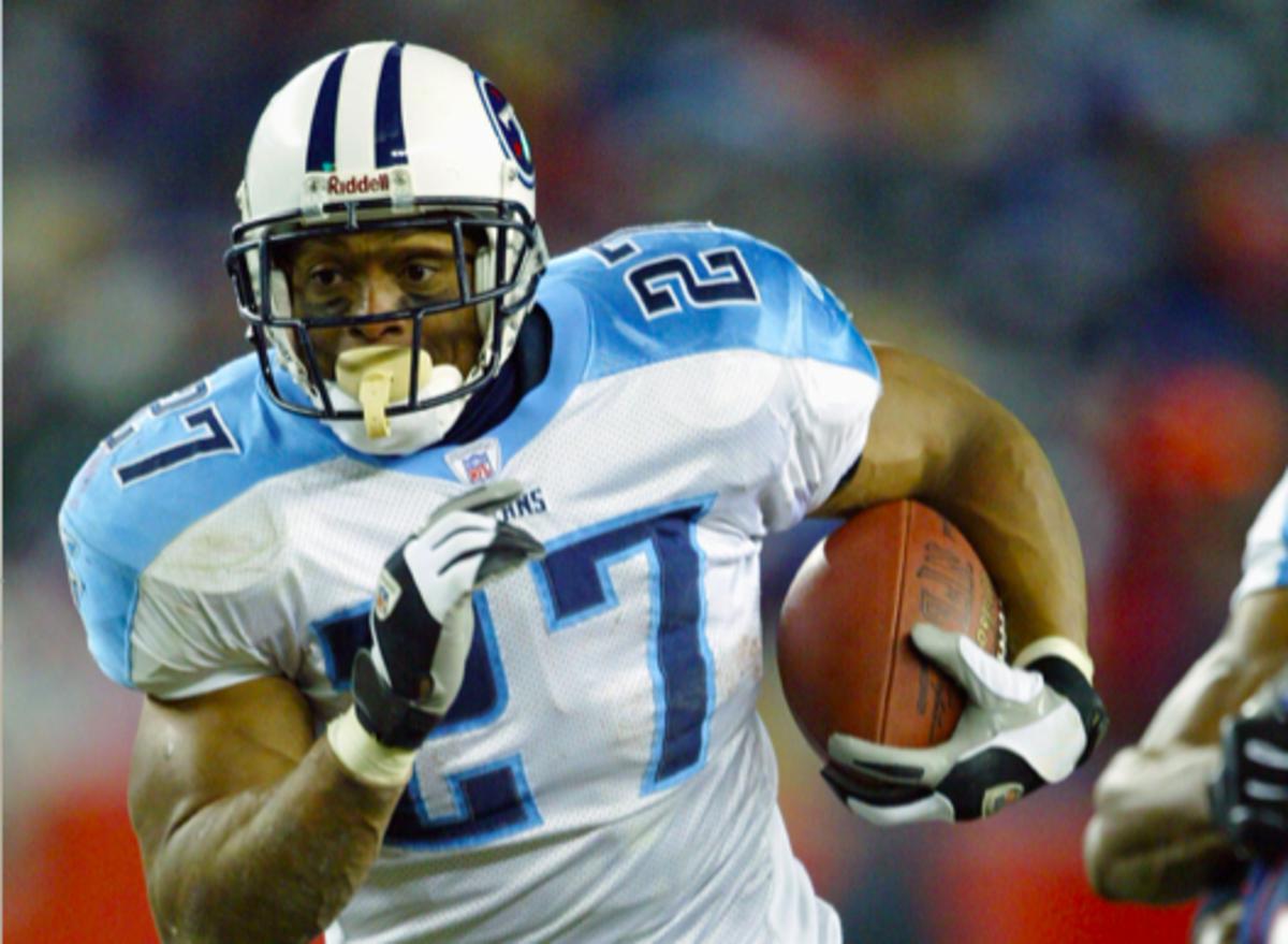 Eddie George of the Tennessee Titans carries the ball during the game