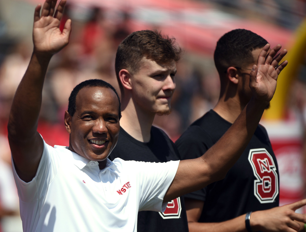 Kevin Keatts salutes the crowd after being introduced at last week's football game at Carter-Finley Stadium