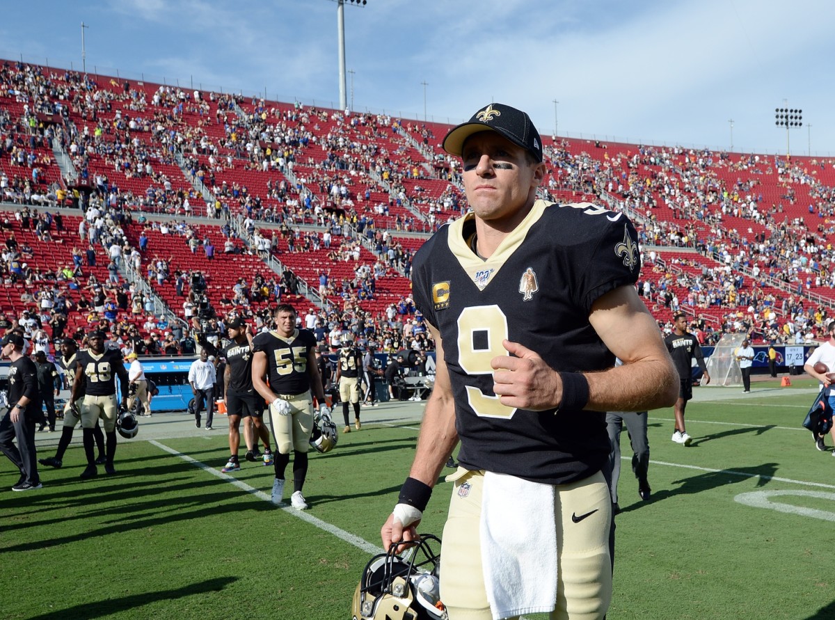 New Orleans Saints' quarterback Drew Brees leaves the field after