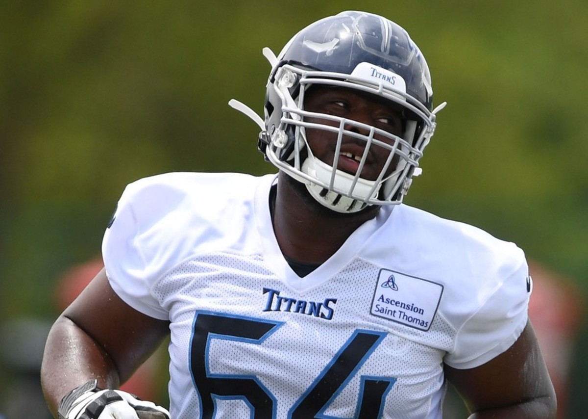 Tennessee Titans guard Nate Davis (64) runs drills during minicamp at Saint Thomas Sports Park.