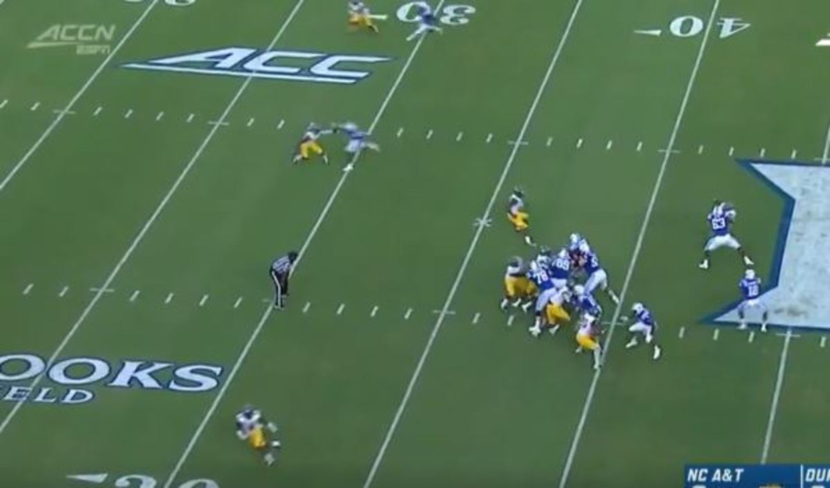 The A&T safety (bottom left) turns toward the sideline for an instant as Calhoun (crossing the 30 midfield) heads downfield behind him