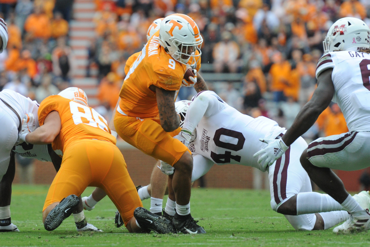 Oct 12, 2019; Knoxville, TN, USA; Tennessee Volunteers running back Tim Jordan (9) runs the ball against Mississippi State Bulldogs linebacker Erroll Thompson (40) during the second quarter at Neyland Stadium. Mandatory Credit: Randy Sartin-USA TODAY Sports