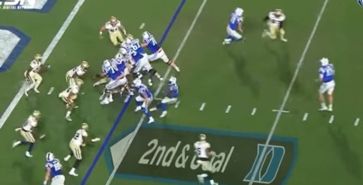 Jones (far right) at the 12, as Wilson (at the six, just above the 2 in "2nd & Goal") pulls up. Two GT edge rushers are at the nine yard line, pursuing Jones.
