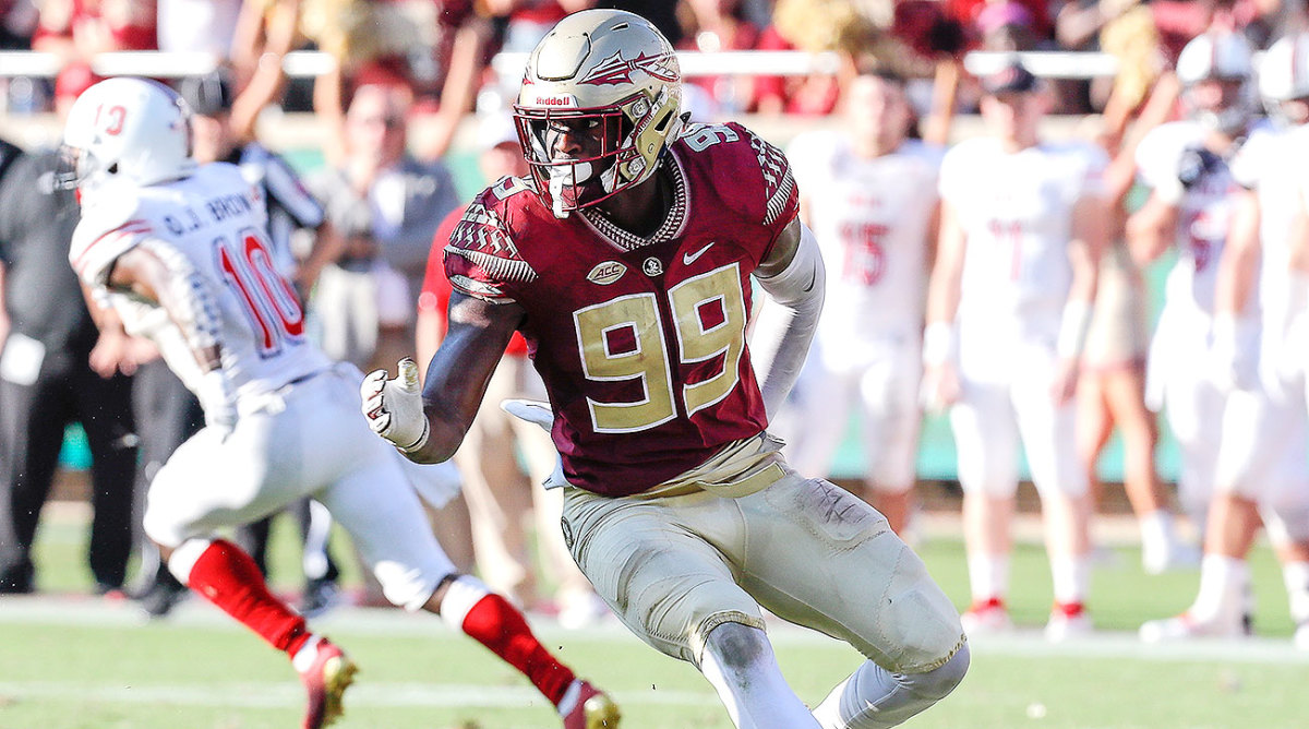 Florida State linebacker Brian Burns poses with his new team