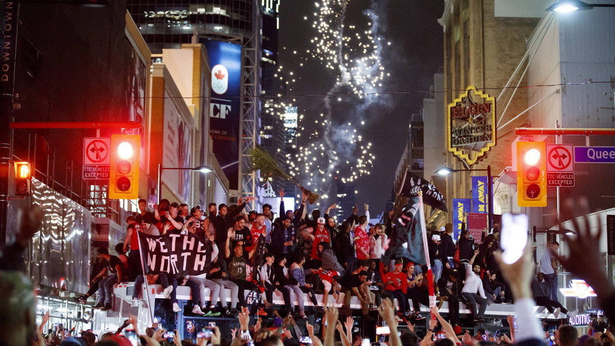 Fans celebrating Toronto Raptors' NBA championship rush to secure
