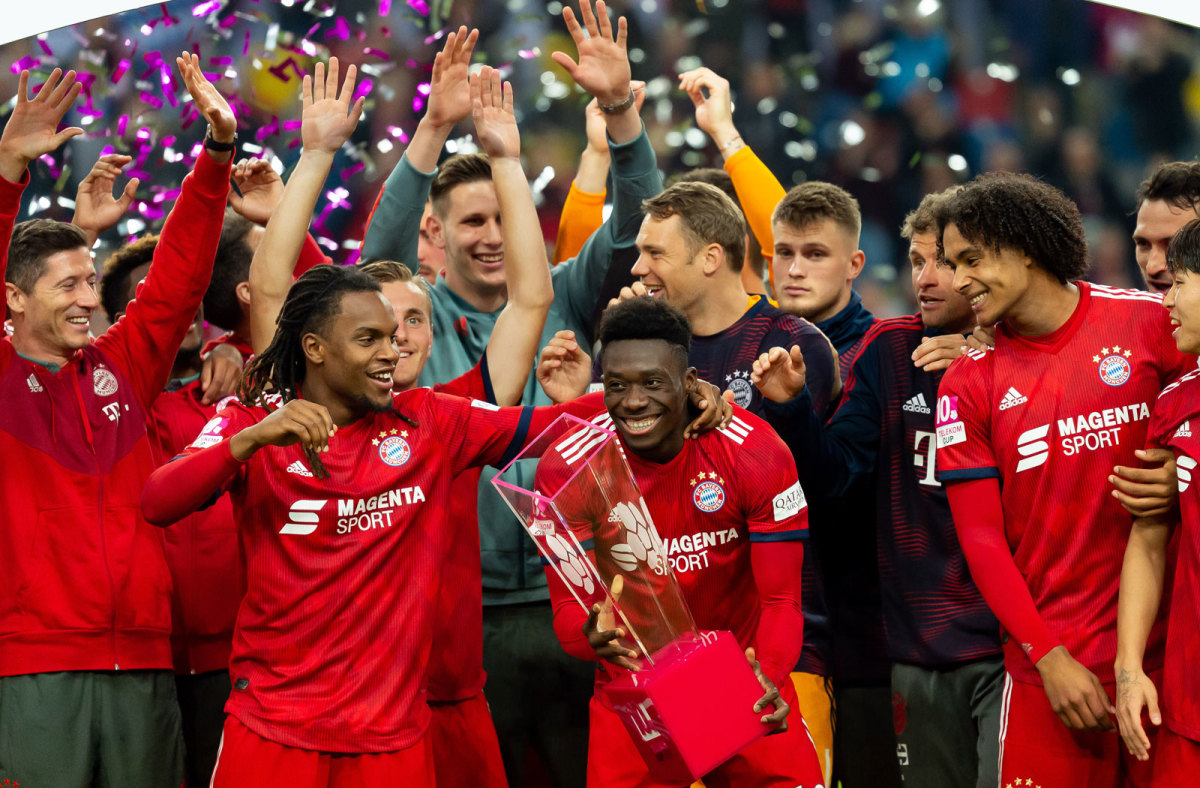 Alphonso Davies gets soaked in champagne during TV interview after Bayern  Munich clinch Champions League, London Evening Standard