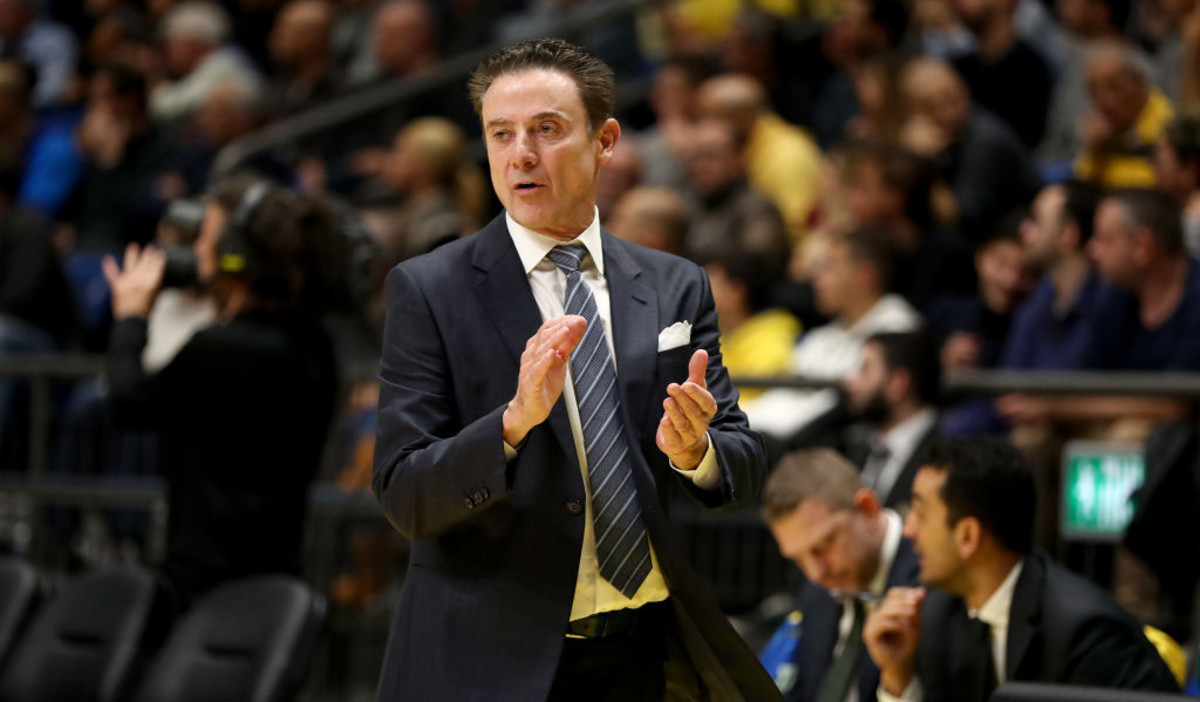 St. John's coach Rick Pitino throws out first pitch to Donovan