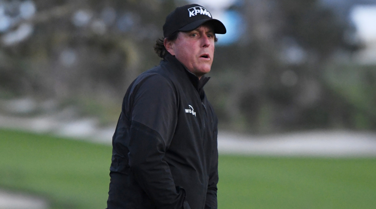 Mickelson wanted to finish in dark, play suspended at ...