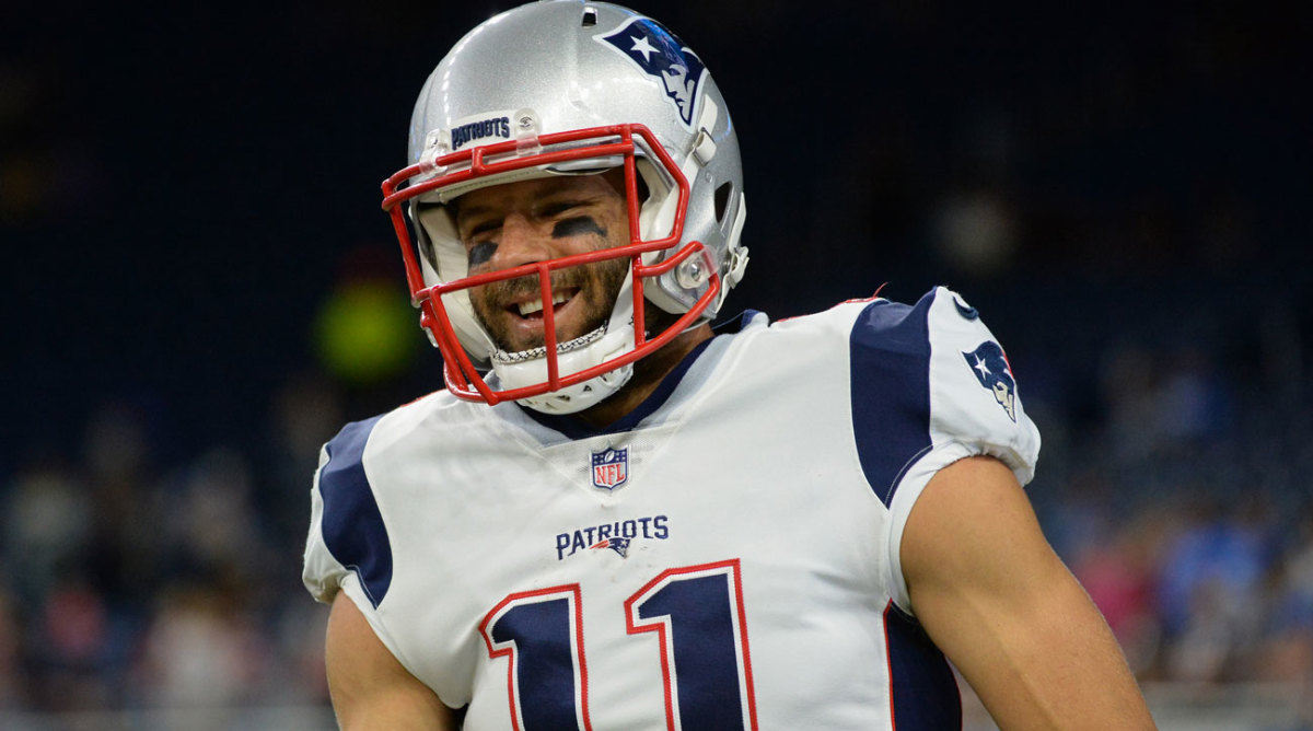 Julian Edelman, wide receiver for the New England Patriots, shakes the  hands of Marines from Marine Corps Band New Orleans before the start of the  game against the Seattle Seahawks at Gillette