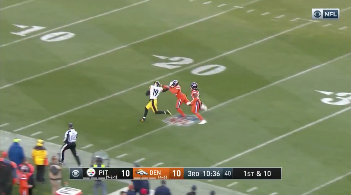 Denver, Colorado, USA. 25th Nov, 2018. Steelers WR JUJU SMITH-SCHUSTER,  center, gets hit after a catch during the 2nd. Half at Broncos Stadium at  Mile High Sunday afternoon. The Broncos beat the