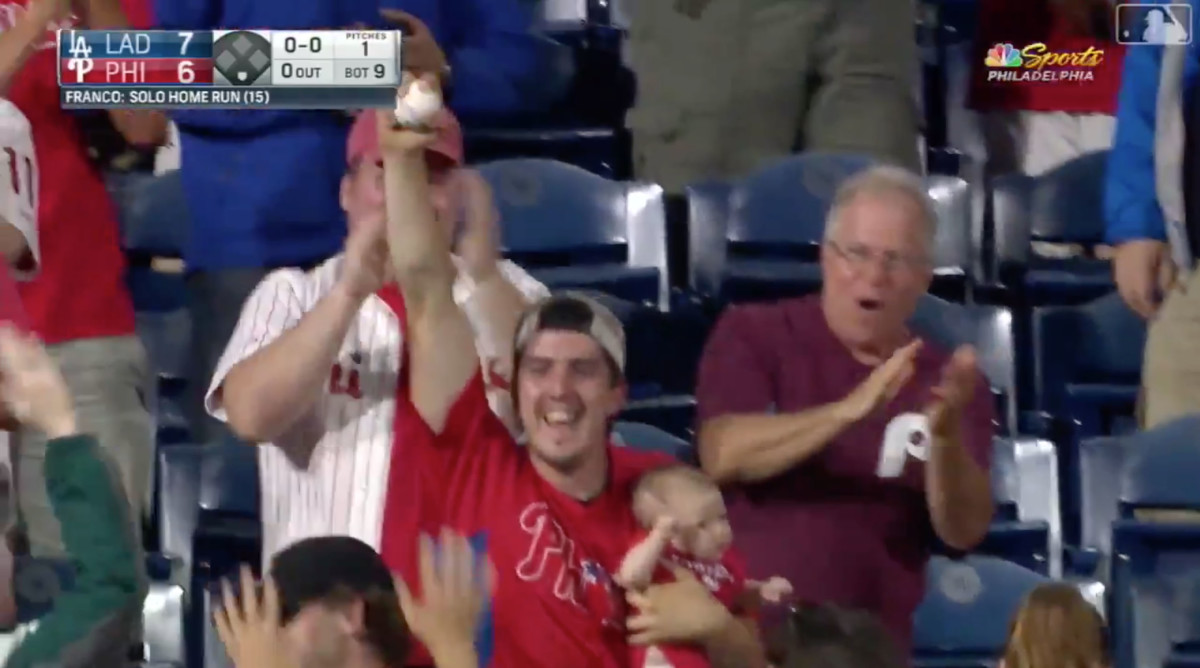 This Phillies fan proves you can catch a home run without dropping your  infant 