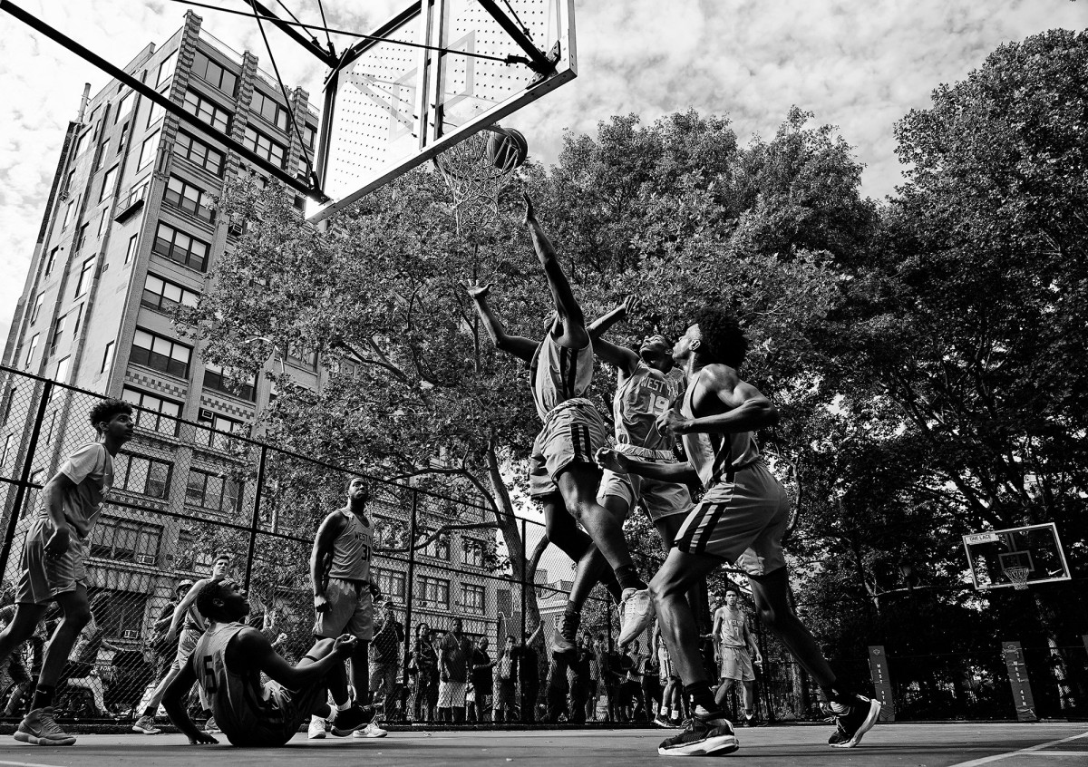 Kids play basketball on the Lower East Side in Manhattan, New York