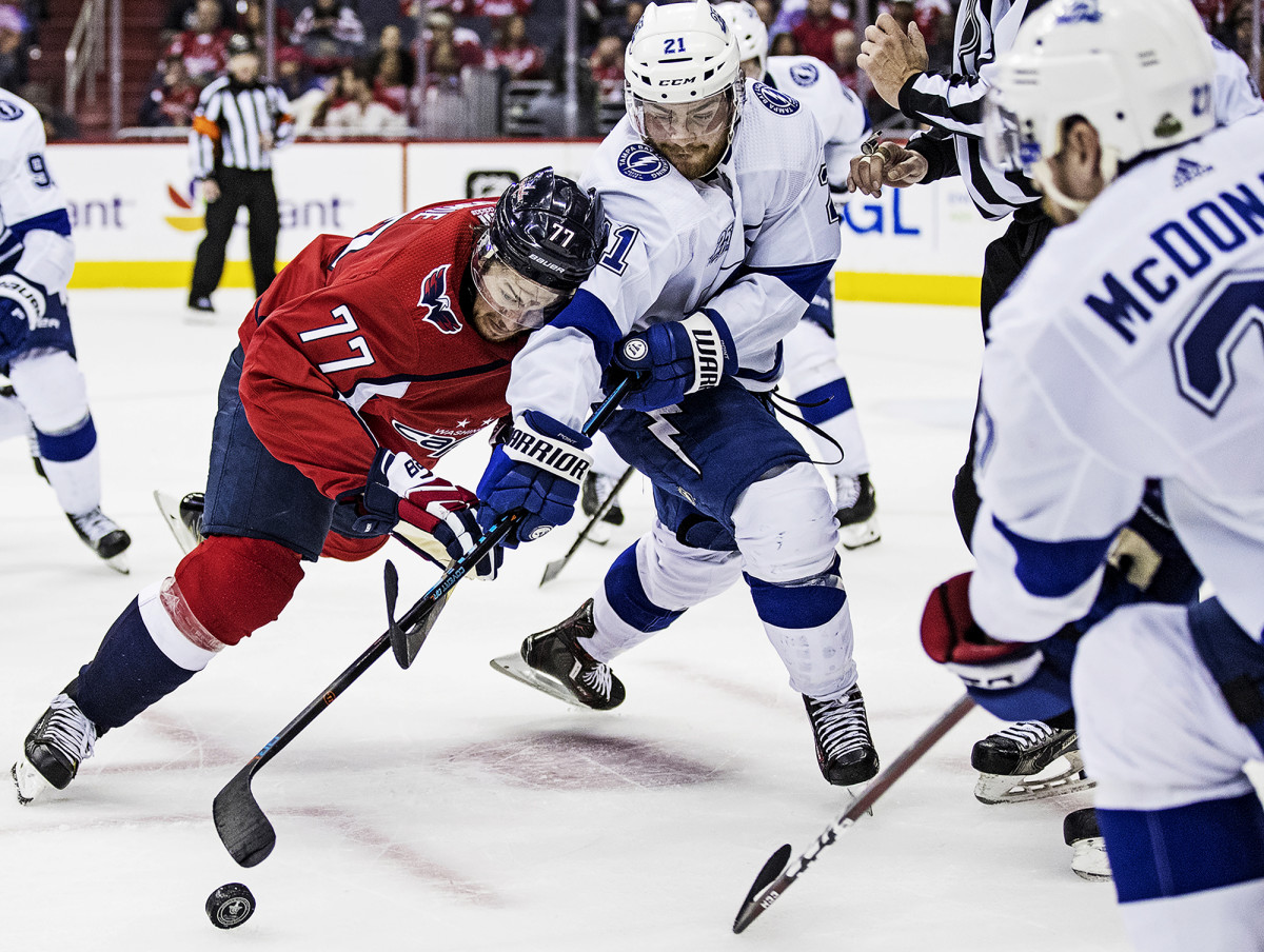 T.J. Oshie of the Washington Capitals vs. Tampa Bay Lightning's Brayden Point in Game 3 of the NHL Eastern Conference Finals