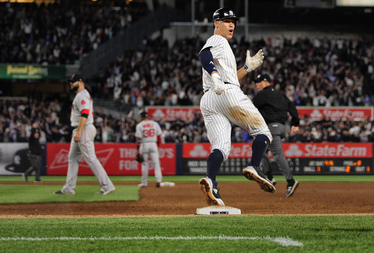 Aaron Judge of the New York Yankees celebrates a homerun against the Red Sox