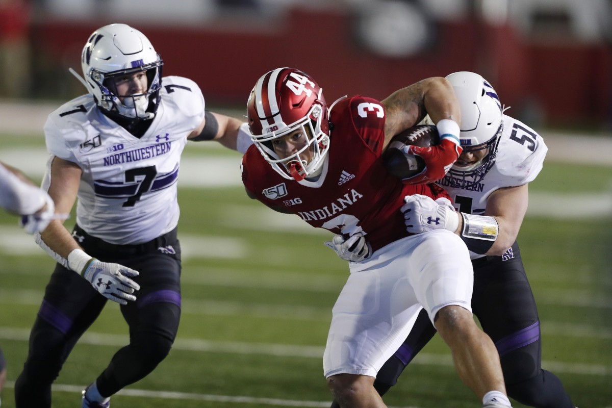 Bloomington, IN, USA; Indiana Hoosiers wide receiver Ty Fryfogle (3) gets tackled by Northwestern Wildcats linebacker Blake Gallagher (51) during the third quarter at Memorial Stadium . Mandatory Credit: Brian Spurlock-USA TODAY Sports