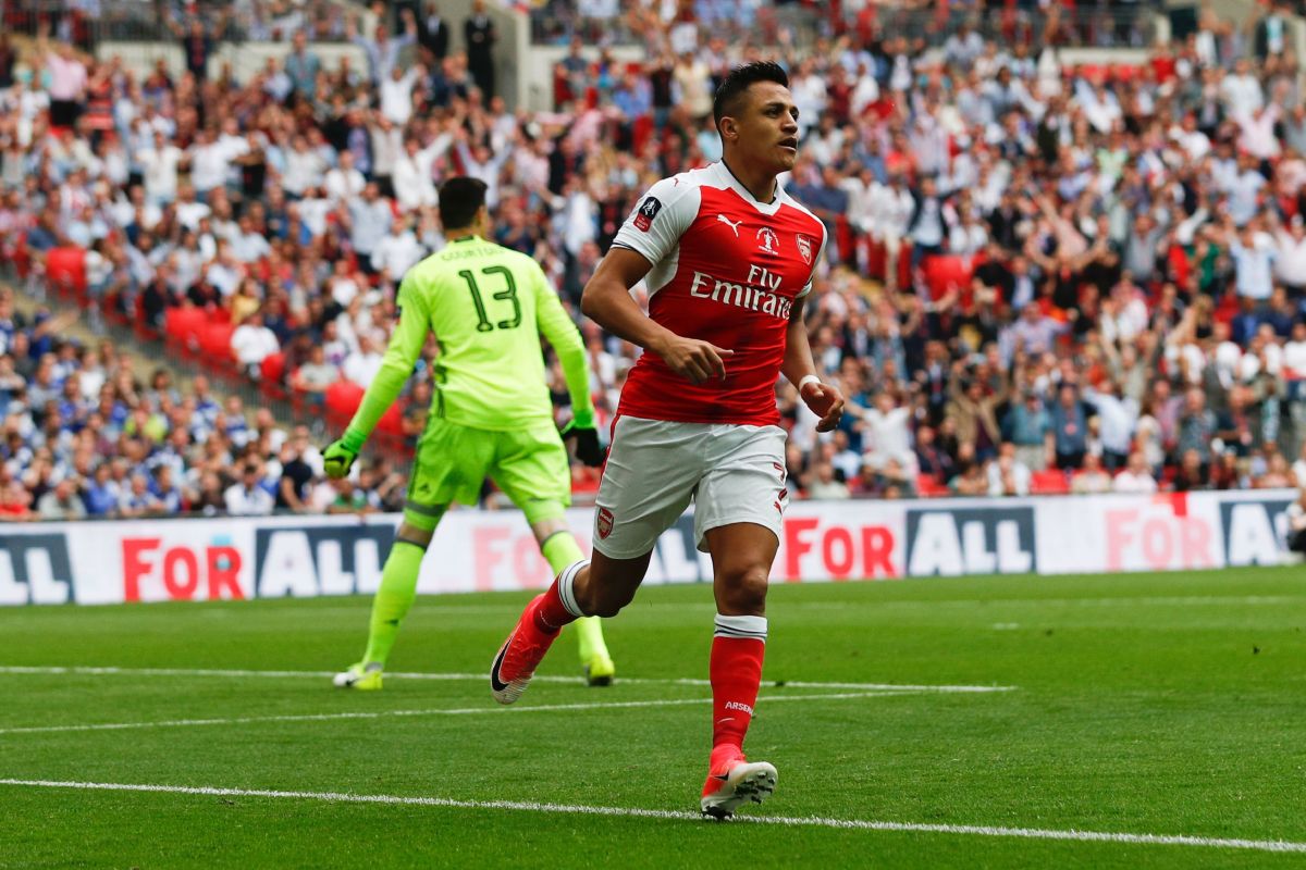 Arsenal's Chilean striker Alexis Sanchez (R) celebrates after scoring the opening goal of the English FA Cup final football match between Arsenal and Chelsea at Wembley stadium in London on May 27, 2017. / AFP PHOTO / Adrian DENNIS / NOT FOR MARKETING OR ADVERTISING USE / RESTRICTED TO EDITORIAL USE        (Photo credit should read ADRIAN DENNIS/AFP/Getty Images)