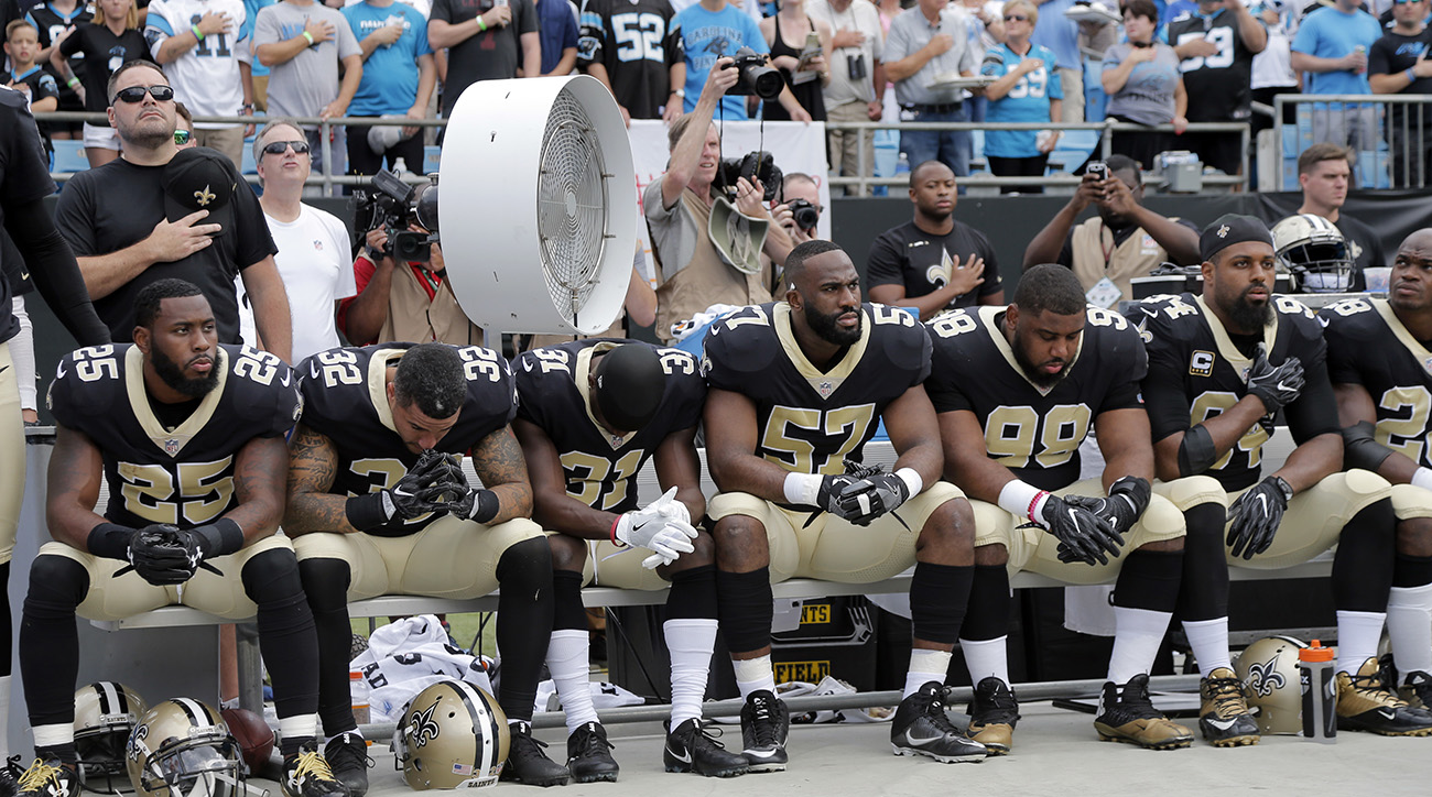 New England Patriots stand during national anthem before Panthers game