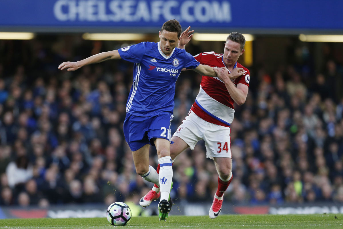 Chelsea's Serbian midfielder Nemanja Matic (L) holds off Middlesbrough's English midfielder Adam Forshaw during the English Premier League football match between Chelsea and Middlesbrough at Stamford Bridge in London on May 8, 2017. / AFP PHOTO / Ian KINGTON / RESTRICTED TO EDITORIAL USE. No use with unauthorized audio, video, data, fixture lists, club/league logos or 'live' services. Online in-match use limited to 75 images, no video emulation. No use in betting, games or single club/league/player publications.  /         (Photo credit should read IAN KINGTON/AFP/Getty Images)