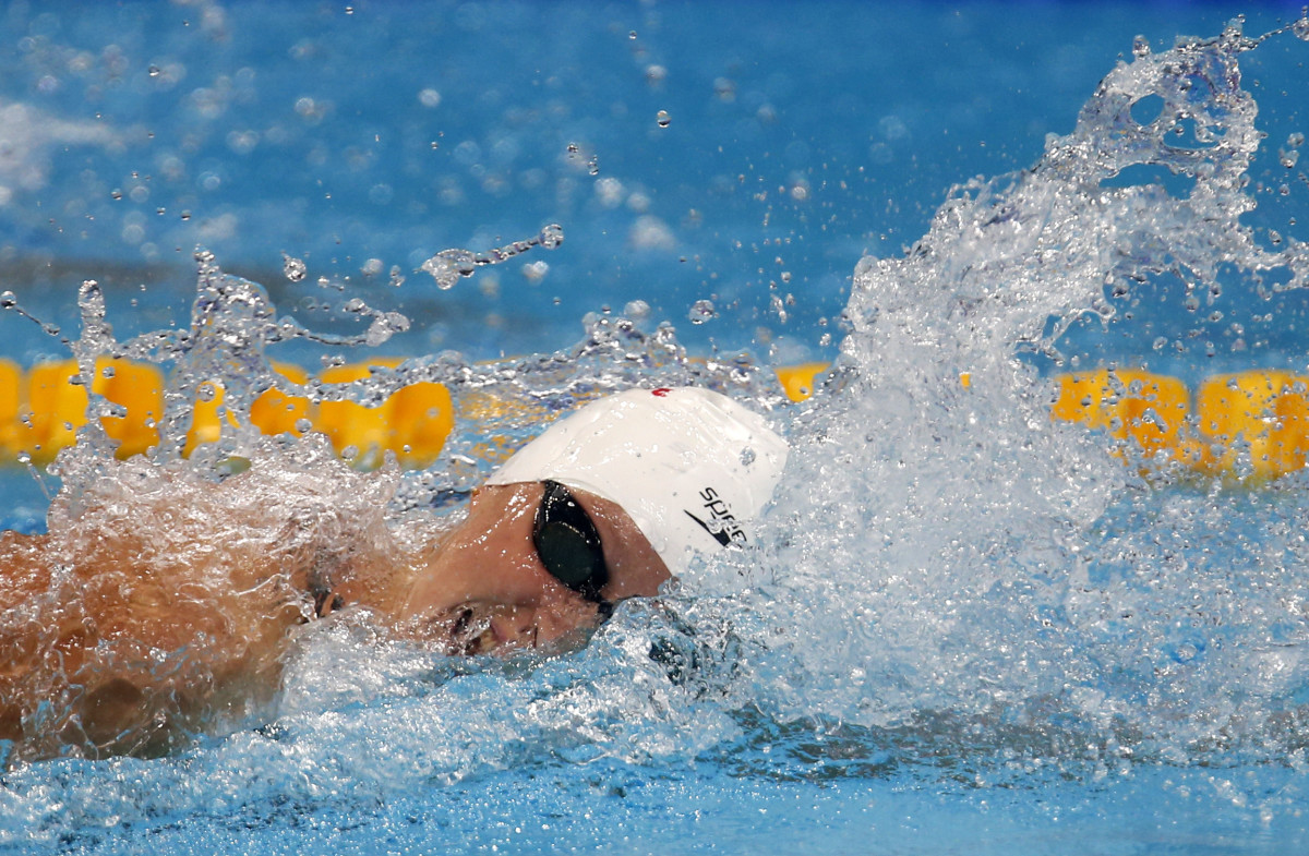 Katie Ledecky breezes to 3rd worlds gold in 1,500 freestyle - Sports ...