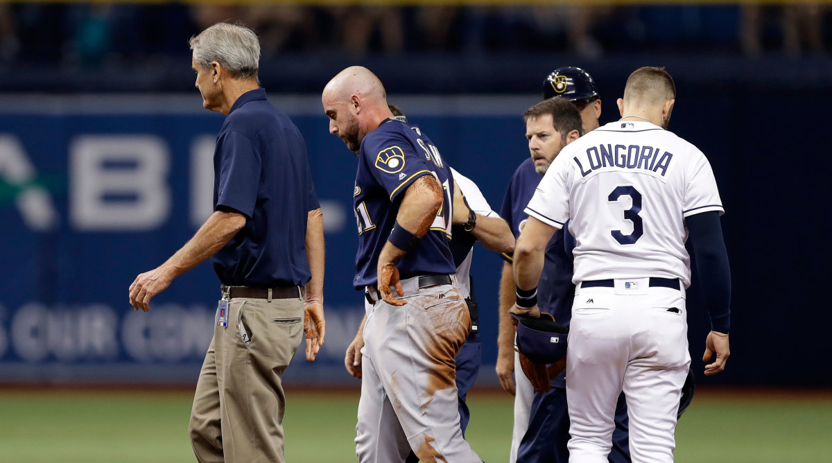 Travis Shaw: Brewers 3B hit in head by throw - Sports Illustrated