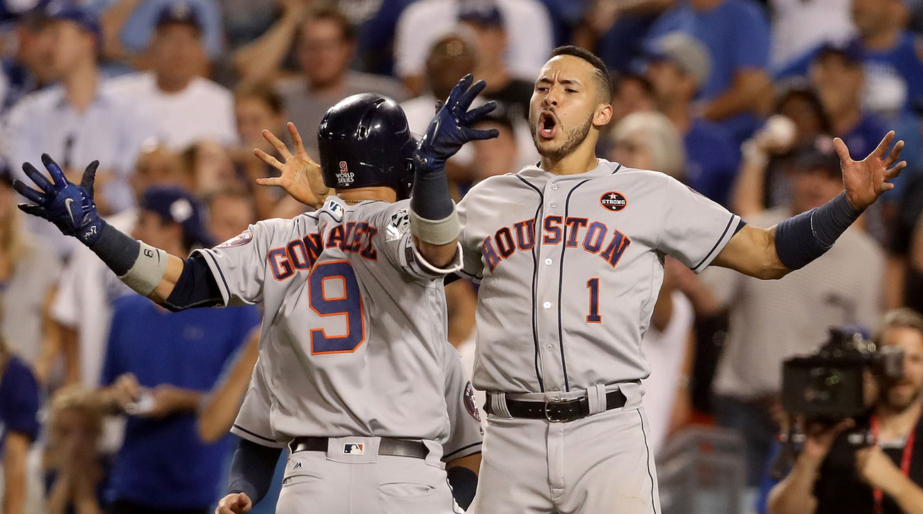 Houston Astros left fielder Marwin Gonzalez, from left, Carlos Correa and  George Springer celebrate their win against the Los Angeles Dodgers during  Game 2 of baseball's World Series Wednesday, Oc …