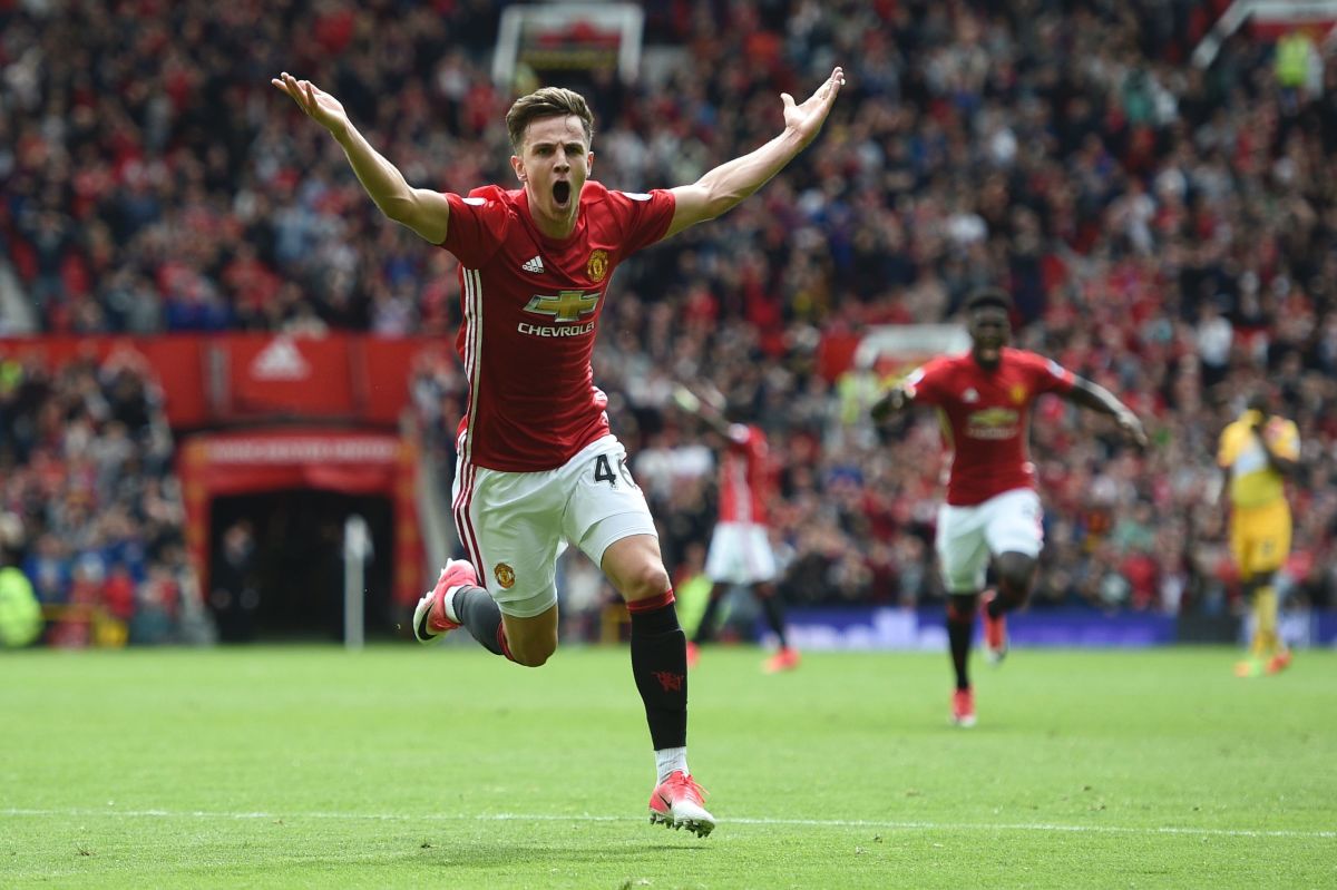 Manchester United's English midfielder Josh Harrop celebrates scoring the opening goal during the English Premier League football match between Manchester United and Cyrstal Palace at Old Trafford in Manchester, north west England, on May 21, 2017. / AFP PHOTO / Oli SCARFF / RESTRICTED TO EDITORIAL USE. No use with unauthorized audio, video, data, fixture lists, club/league logos or 'live' services. Online in-match use limited to 75 images, no video emulation. No use in betting, games or single club/league/player publications.  /         (Photo credit should read OLI SCARFF/AFP/Getty Images)