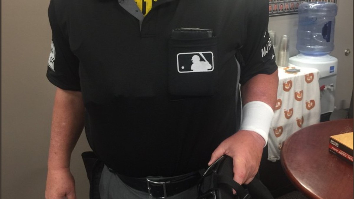 Major league umpires wear wristbands to protest 'escalating verbal attacks'  from players 