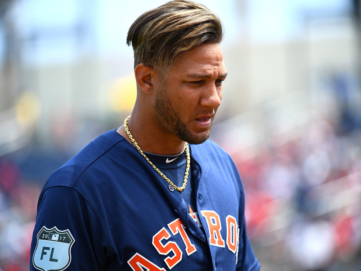 Miami Marlins' Yuli Gurriel reflects as he faces Houston Astros