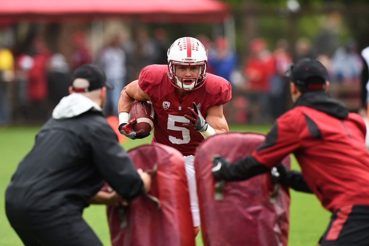 Stanford University quarterback John Elway, right, laughs with his